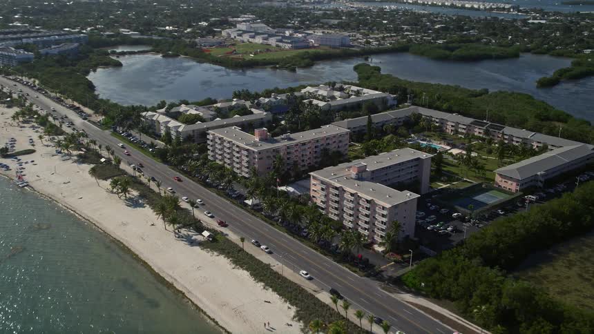 A stunning aerial view of Sheraton Suites and nearby apartment buildings along the coastline of Key West Florida