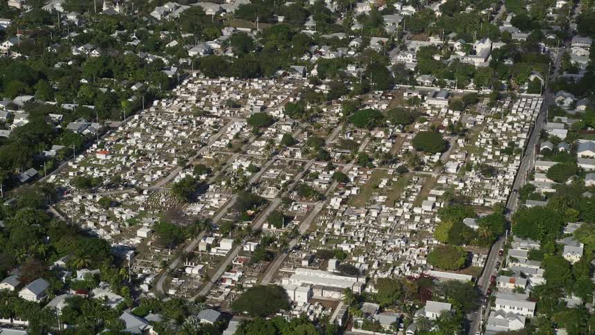 Approaching the Key West Cemetery a spiritual and holy resting place for the deceased surrounded by houses in a residential neighborhood in Florida
