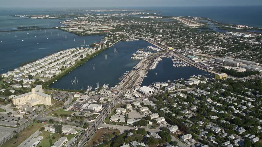 A beautiful aerial view of Palm Avenue Causeway in Key West Florida showing the coastal road and seaside residences