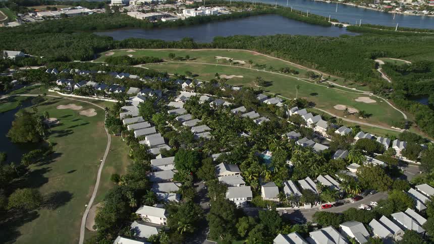 Aerial footage of Suburban neighborhoods located close to a golf course in Key West Florida