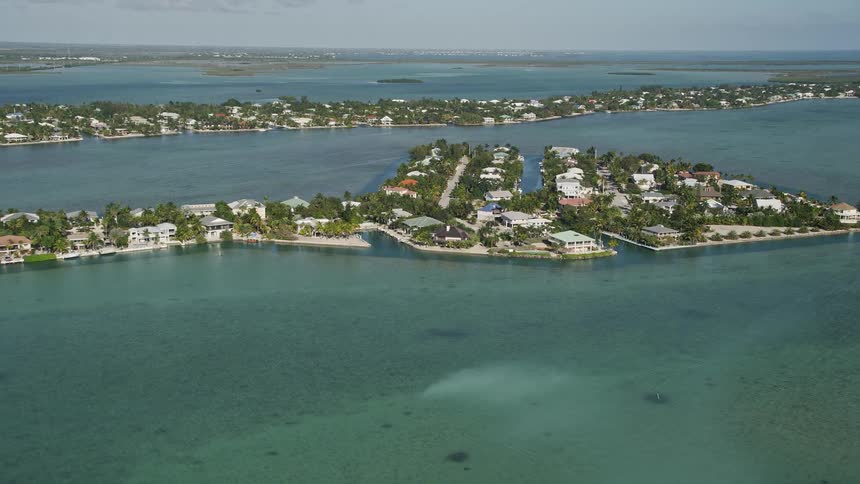 Approaching residential neighborhoods with a marina and houses on Lower Sugarloaf Key captured in stunning aerial footage