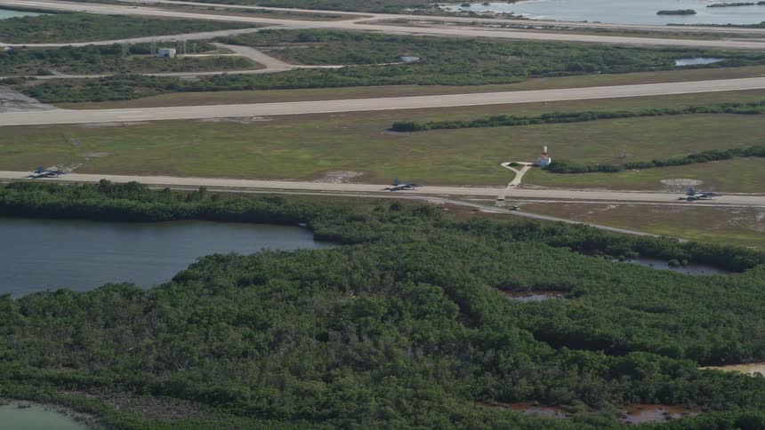 F-18 jets are tracked as they taxi on the runway in the Naval Air Station Key West Florida