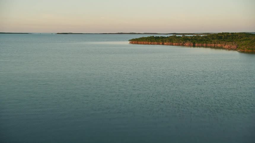 Flying over mangroves on a sunny Florida evening in Islamorada approaching sunset