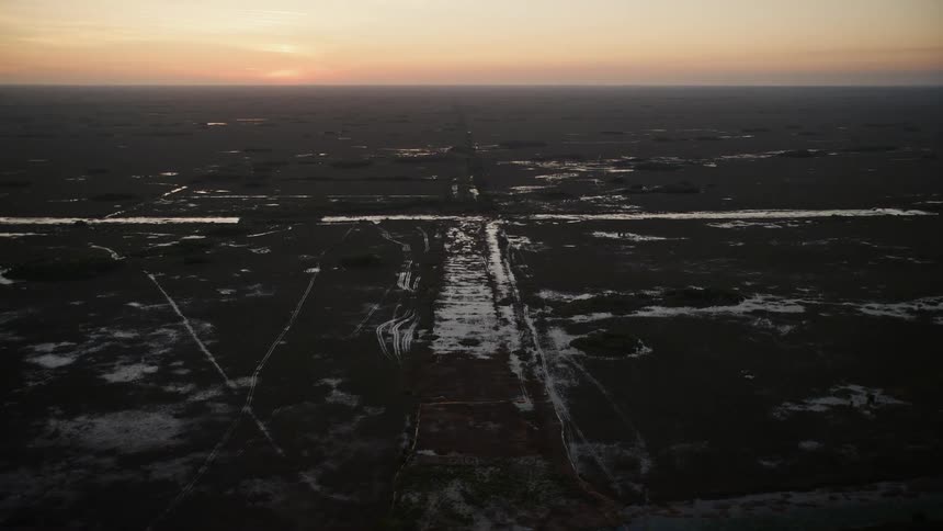 Flying over a Southern Glades wetland during twilight capturing the marshland in Floridas nature
