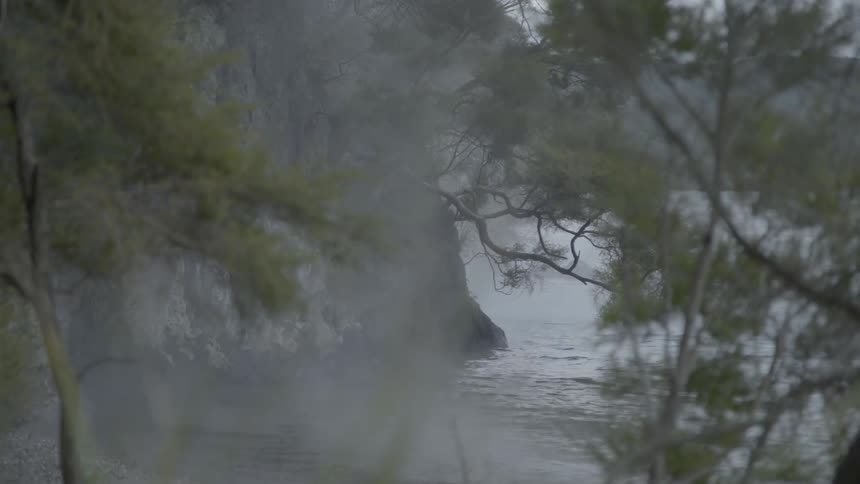 Steam rises off a body of water