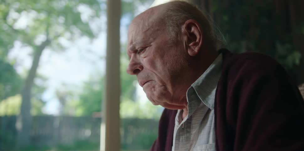 An angry elderly old man at home talks
