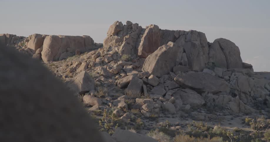 A desert canyon rocks and boulders on a sunny day