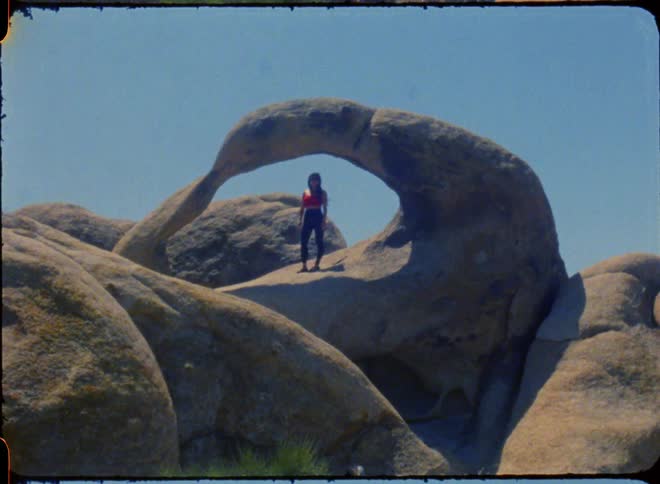 A woman is standing on the stones
