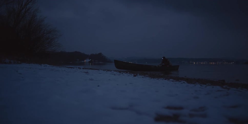 A person is on a boat during winter at night time