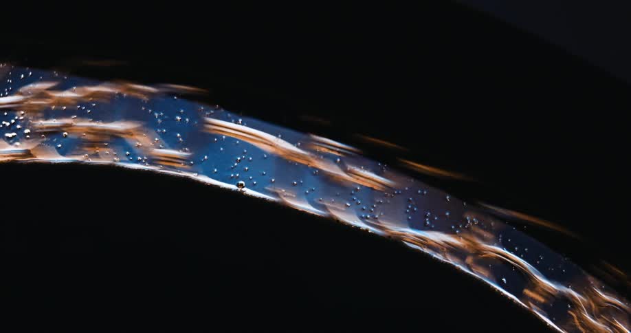A thin silver bangle spins around