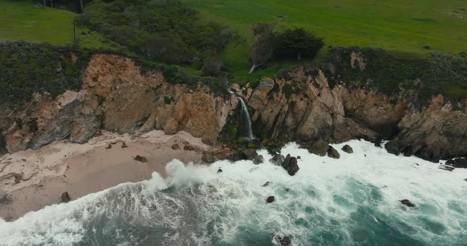 Big waves crashing along rocky beach