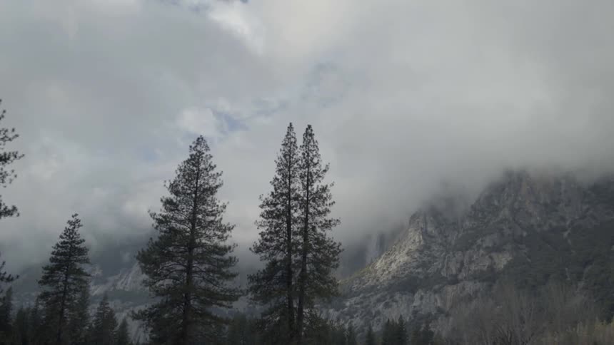 Heavy clouds cover the mountain ahead