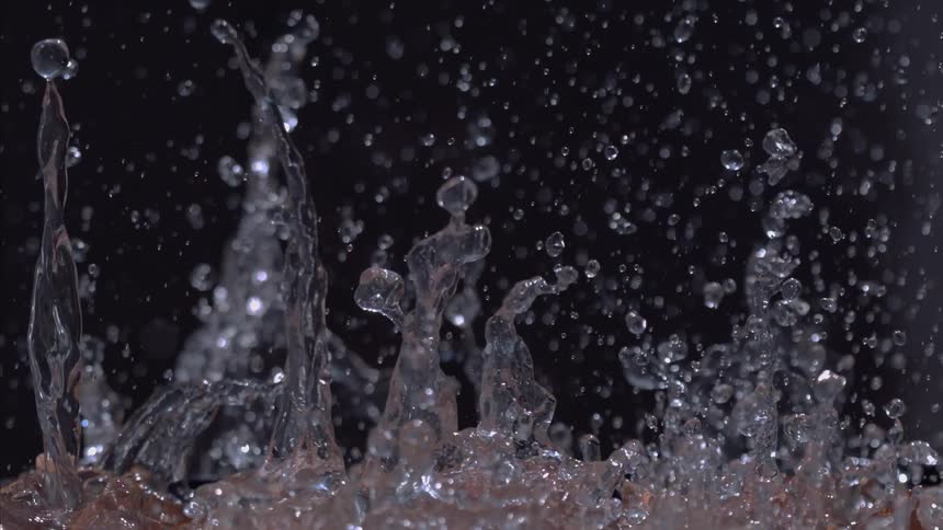 Water droplets and splashes on a black background