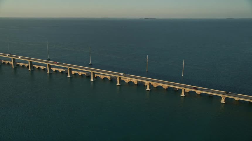 Tracking light traffic on Overseas Highway bridge at sunset Craig Key Florida