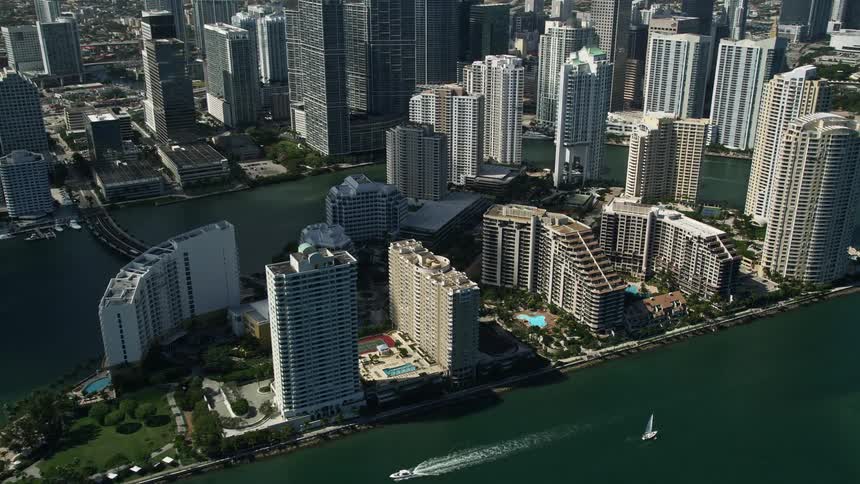The aerial footage features a side view of high rise buildings including the Mandarin Oriental on Brickell Key Island in Downtown Miami Florida