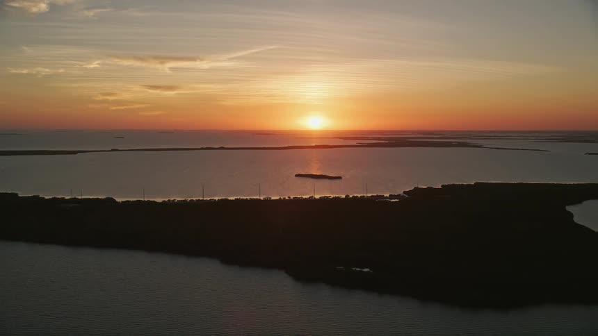 Aerial footage of a Florida sunset over bays and mangroves in Key Largo