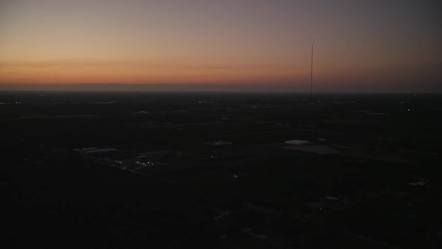 Aerial view of Homestead Florida during twilight with coastline visible in the distance