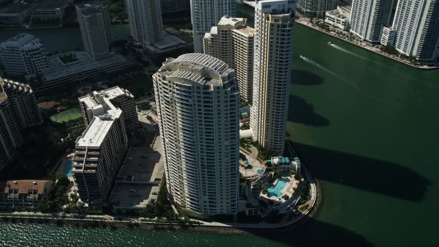 Aerial view of Miamis downtown skyline with skyscrapers lining the coast of Brickell Key on a sunny day in Southern Florida