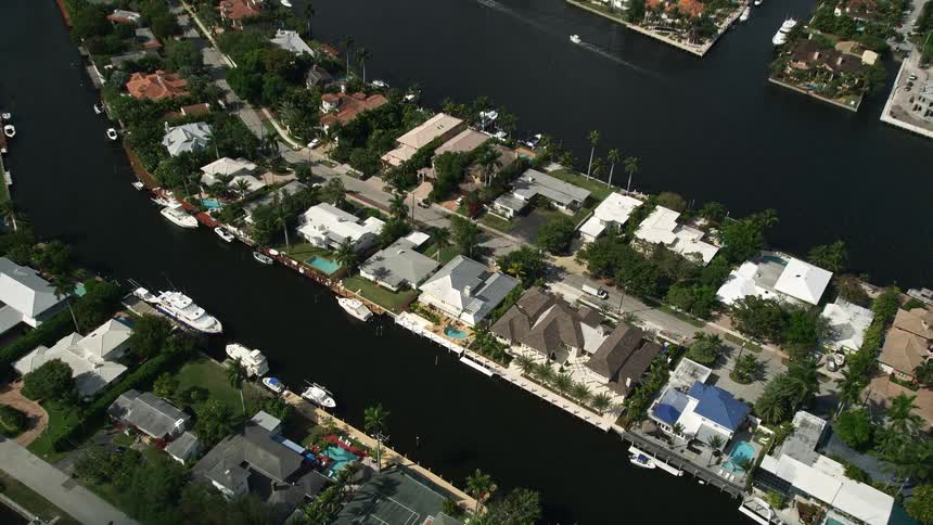 Approaching residential homes sit alongside canals in Fort Lauderdale Florida