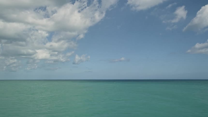 Aerial view of Fort Pierce Florida coastline with gentle waves rippling in the ocean during the daytime