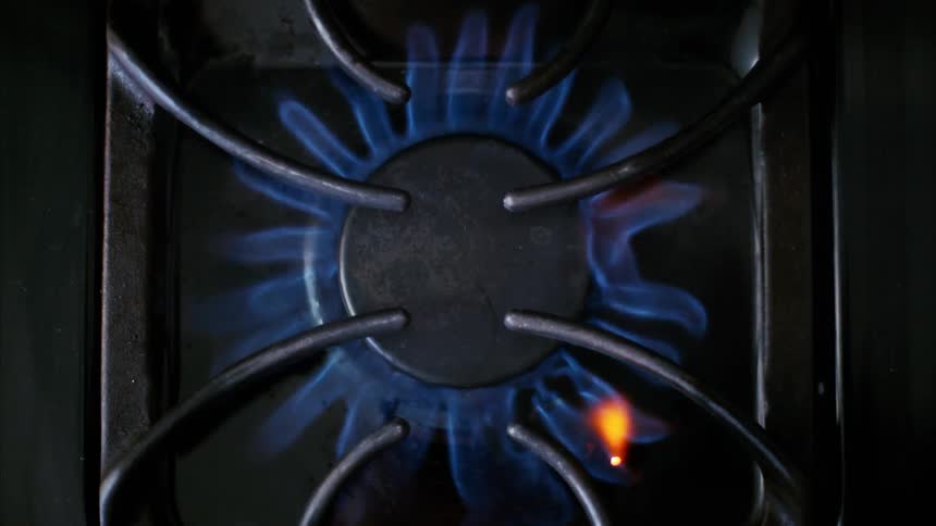 A gas stove burner ignites