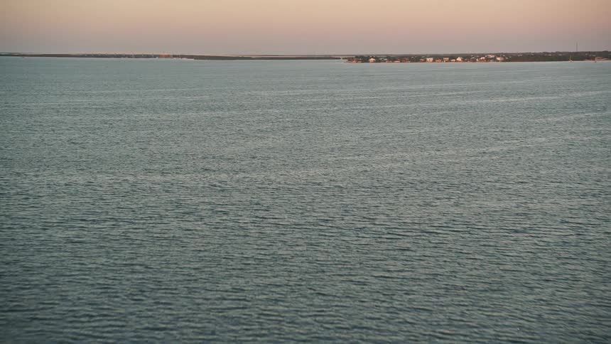 Flying over mangroves and a bay at sunset enjoying the tranquil beauty of Key Largo Floridas nature and shoreline