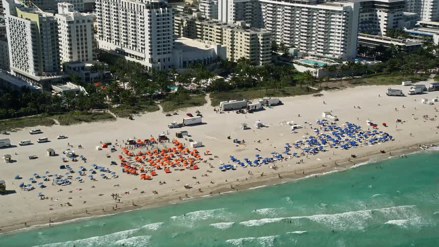 A stunning aerial view of sunbathers enjoying their day on the famous South Beach in Miami Florida