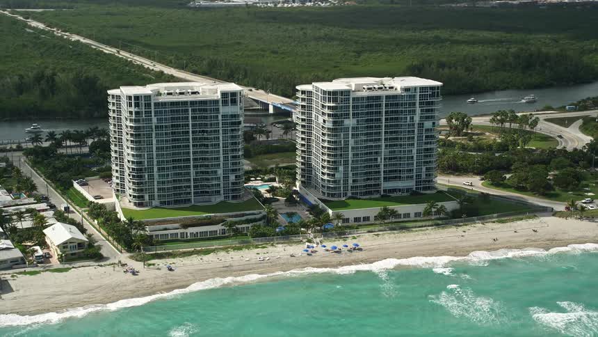Tracking aerial view of Renaissance on the Ocean condominiums in Hollywood FL with stunning beach and coastline scenery