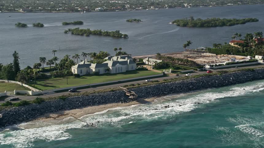 Aerial view of a luxurious mansion by the Palm Beach coastline Floridas upscale coastal community