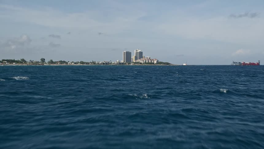 Flying over Palm Beach Shores in Florida this aerial footage showcases the beautiful coastline seashores and residential residences
