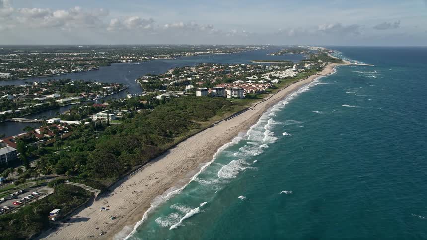 Following the coastline near Boynton Beach Park to approach residential condos on the shores of Florida in South Palm Beach County