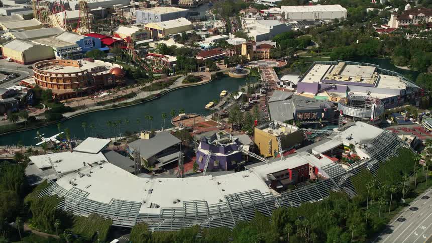 Enjoy a birds eye view of Universal CityWalk in Orlando Florida during a summer day as tourists explore the amusement park restaurants and food courts below