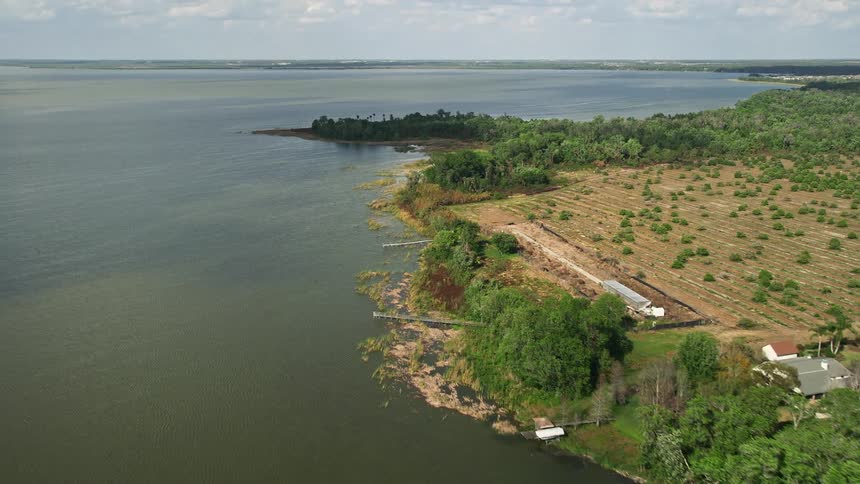 Approaching residential homes by Lake Apopka Florida during daytime aerial footage