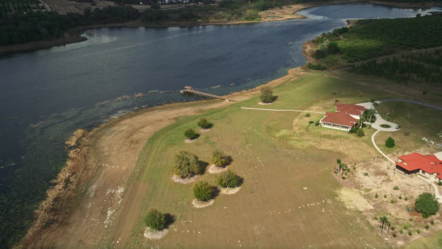 Aerial view of homes by Lake Avalon approaching the dock in Winter Garden FL