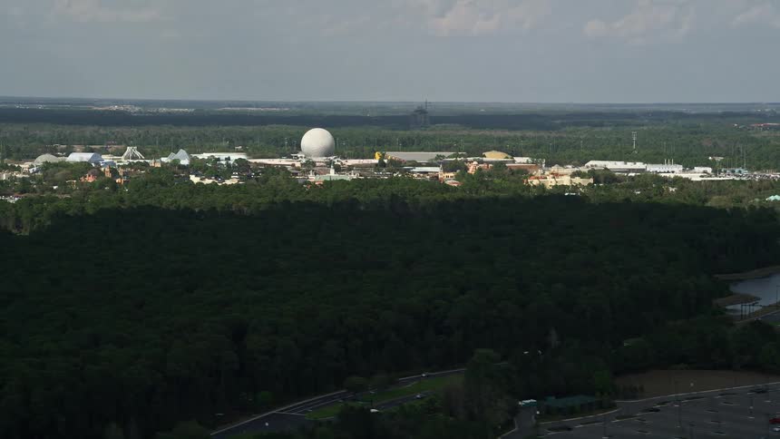 Aerial view of Epcot Theme Park in Walt Disney World Orlando Florida on a partly cloudy day providing entertainment and leisure activities for tourists and visitors