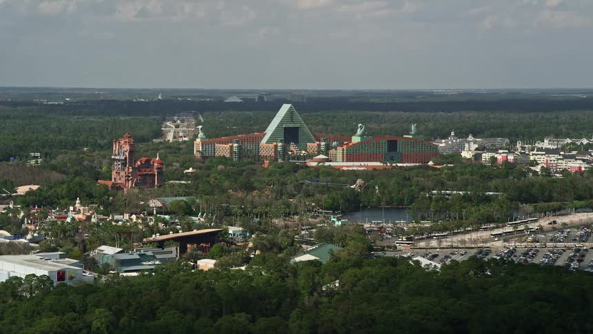 Aerial view of Walt Disney World Dolphin hotel revealing the Tower of Terror surrounded by a colorful theme park