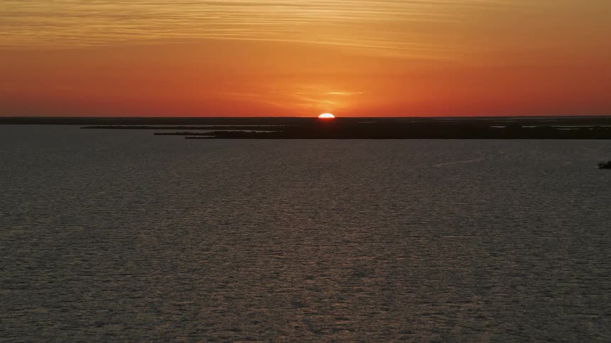 Ascending over the water an aerial view captures the beauty of Key Largo at sunset
