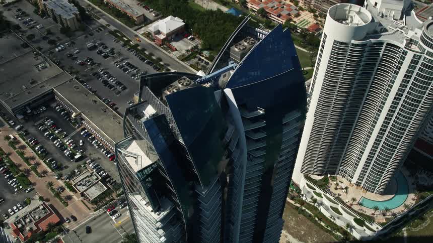 Approaching Jade Beach condominiums by air this high-rise residential superstructure located alongside a picturesque street in Sunny Isles Beach is captured in all its glory