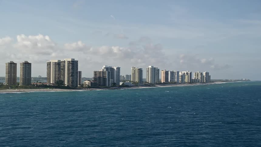 A stunning aerial footage of shoreline condominium complexes along Riviera Beach Floridas coastal communities