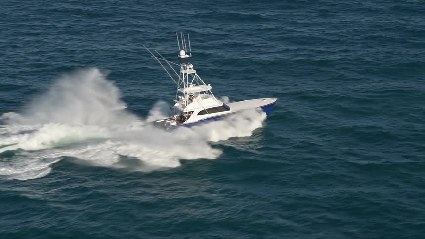 Aerial footage of a fishing boat being tracked on the Atlantic Ocean in Jupiter Florida