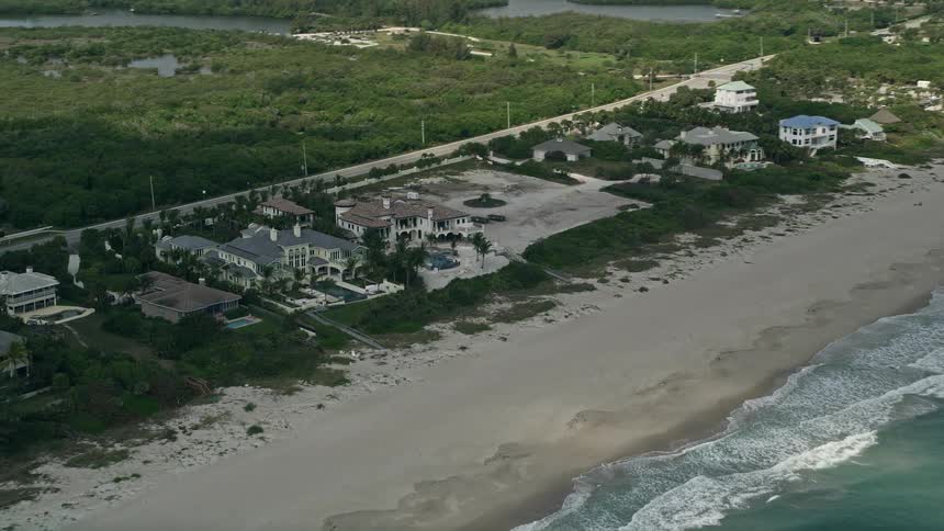 Aerial view of luxurious beachfront mansions on the Florida coast in Vero Beach