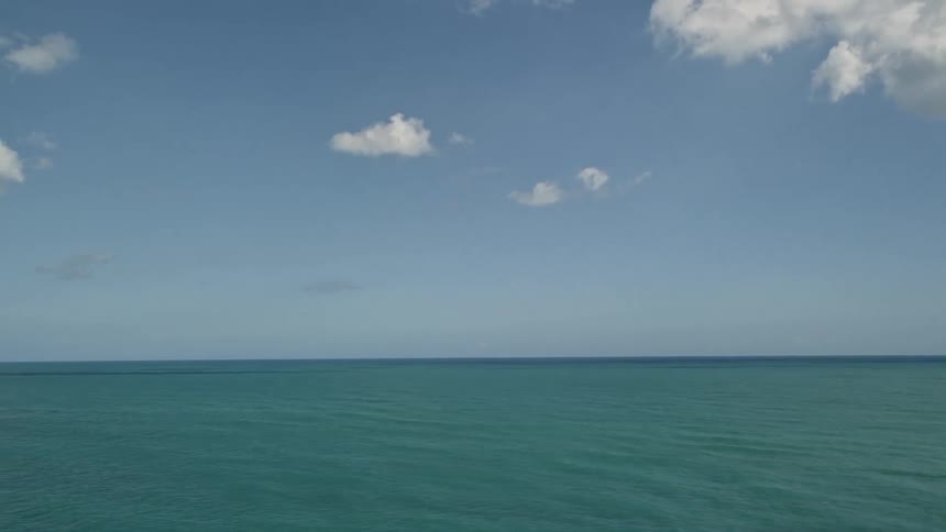 Aerial view of the ocean from Fort Pierce Florida on a partly cloudy day shot in wide angle