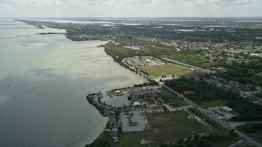 Aerial view of a community park by the river in Merritt Island Florida on a partly cloudy day