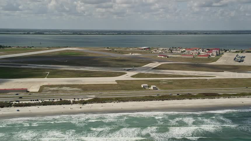 A turboprop plane is seen taking off from Patrick Air Force Base in Florida in an aerial stock footage clip