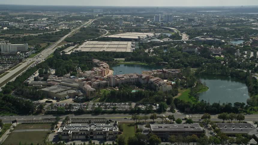 A stunning aerial view of Loews Portofino Bay resort and its surroundings at Universal Studios Florida during summertime