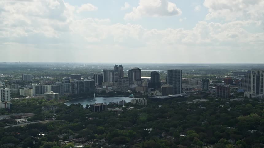 Aerial view of Downtown Orlando and Lake Eola on a partly cloudy day in Central Florida