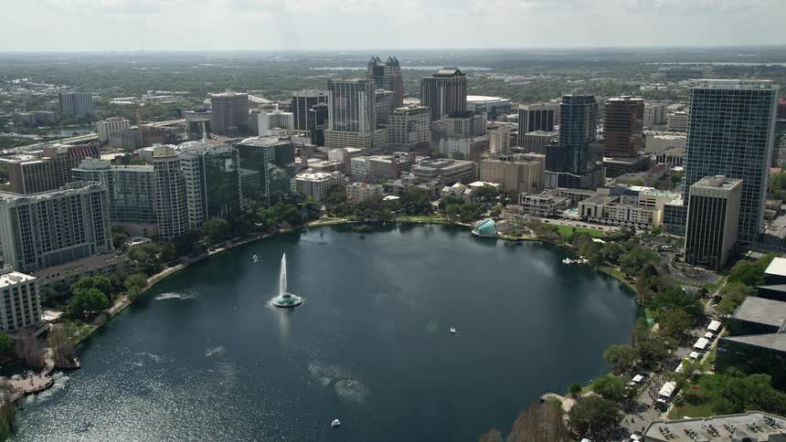 Aerial view of Downtown Orlando and Lake Eola from residential neighborhoods showcasing the beautiful water body and city skyline