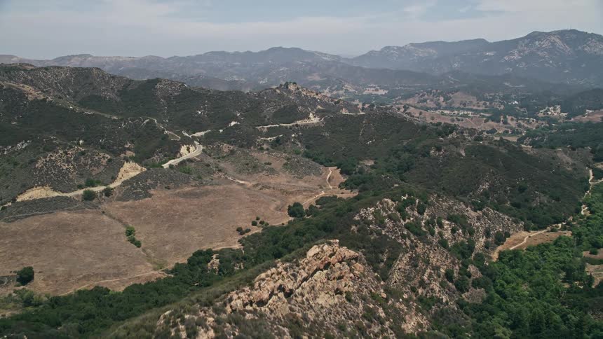 A stunning aerial view of Santa Monica Mountains as the camera approaches Mulholland Highway
