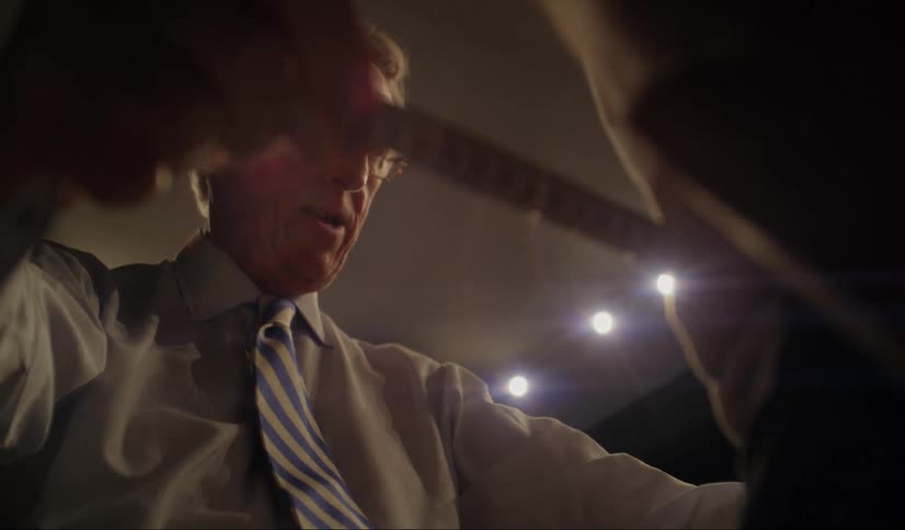 A tailor uses measuring tape to measure someone