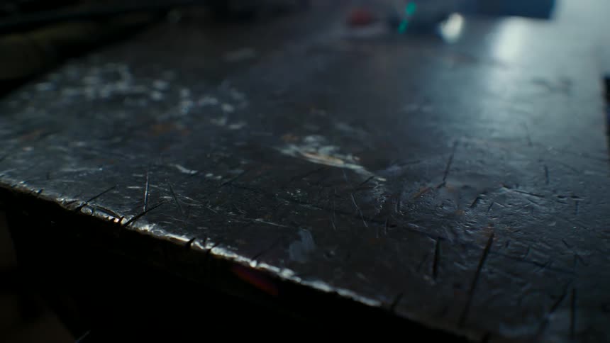 Close up of the distressed surface of a metal press